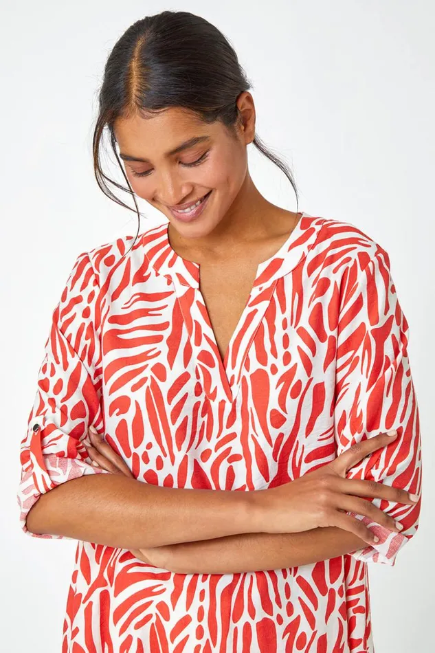 Women Orange Spot Print VNeck Hanky Hem Tunic Top Roman Tops
